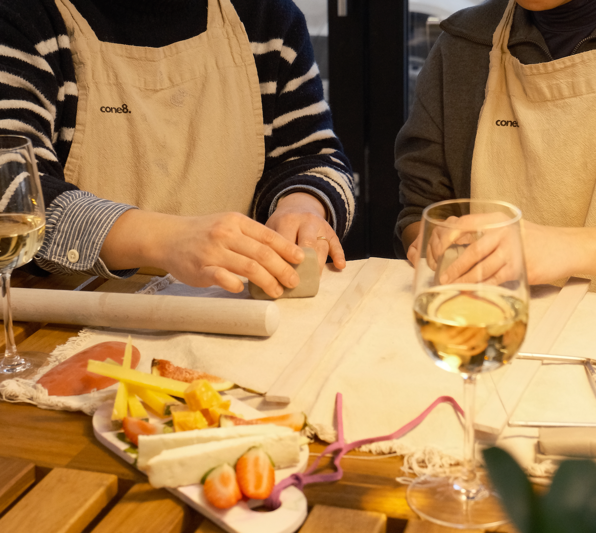 Image Two people making cheese plate